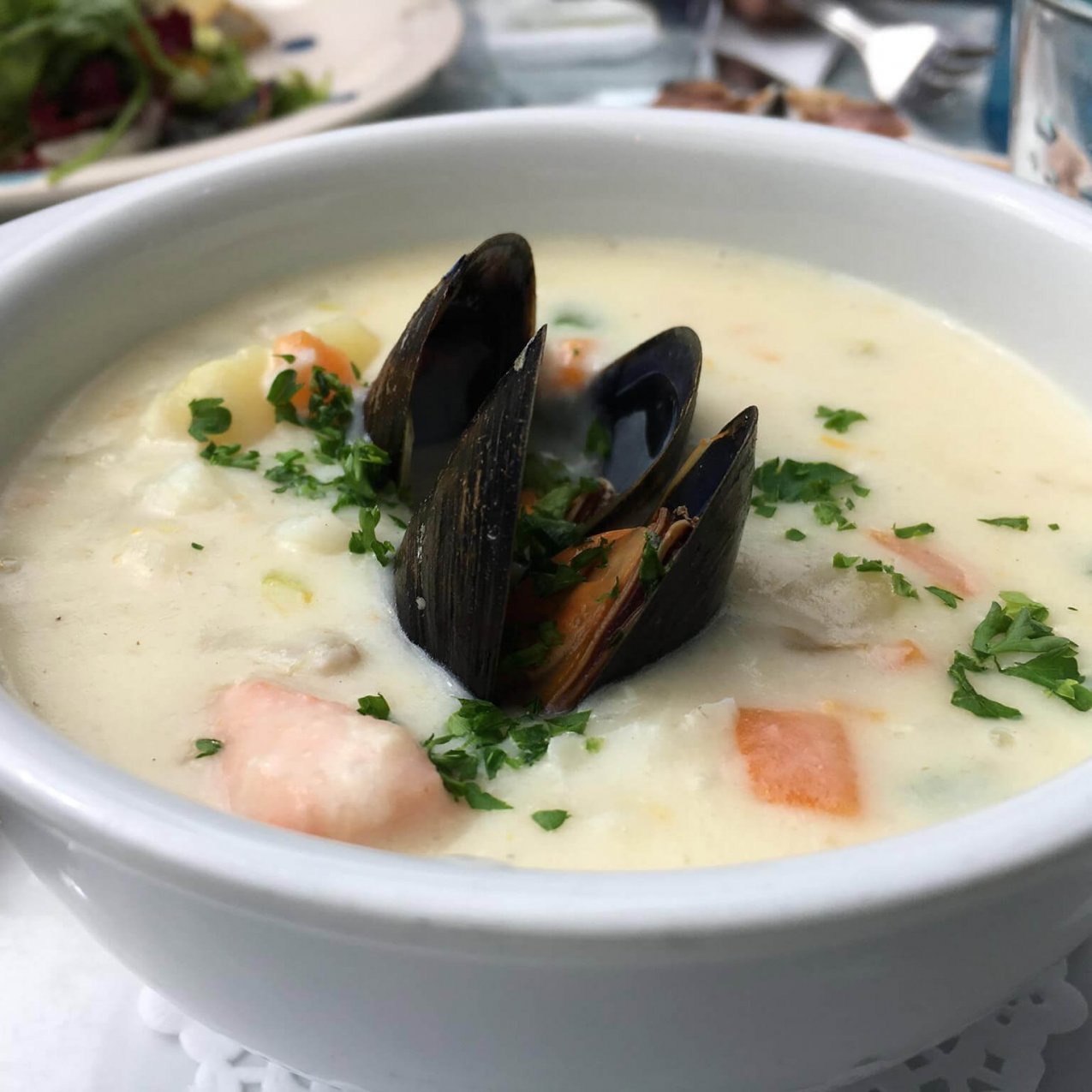 Creamy seafood chowder featuring mussels and herbs
