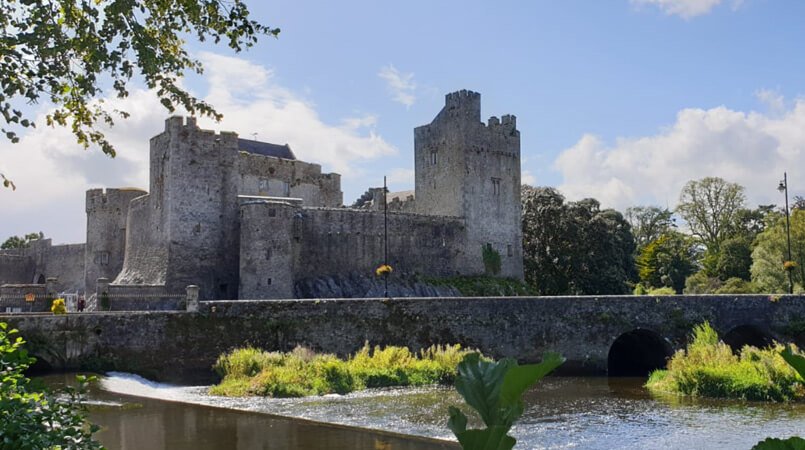A scenic shot of Cahir Castle and the River Suir in Ireland