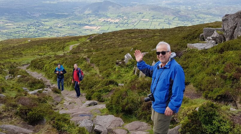 Three Vagabond tour guests hiking on Slieve Gullion mountain in Northern Ireland