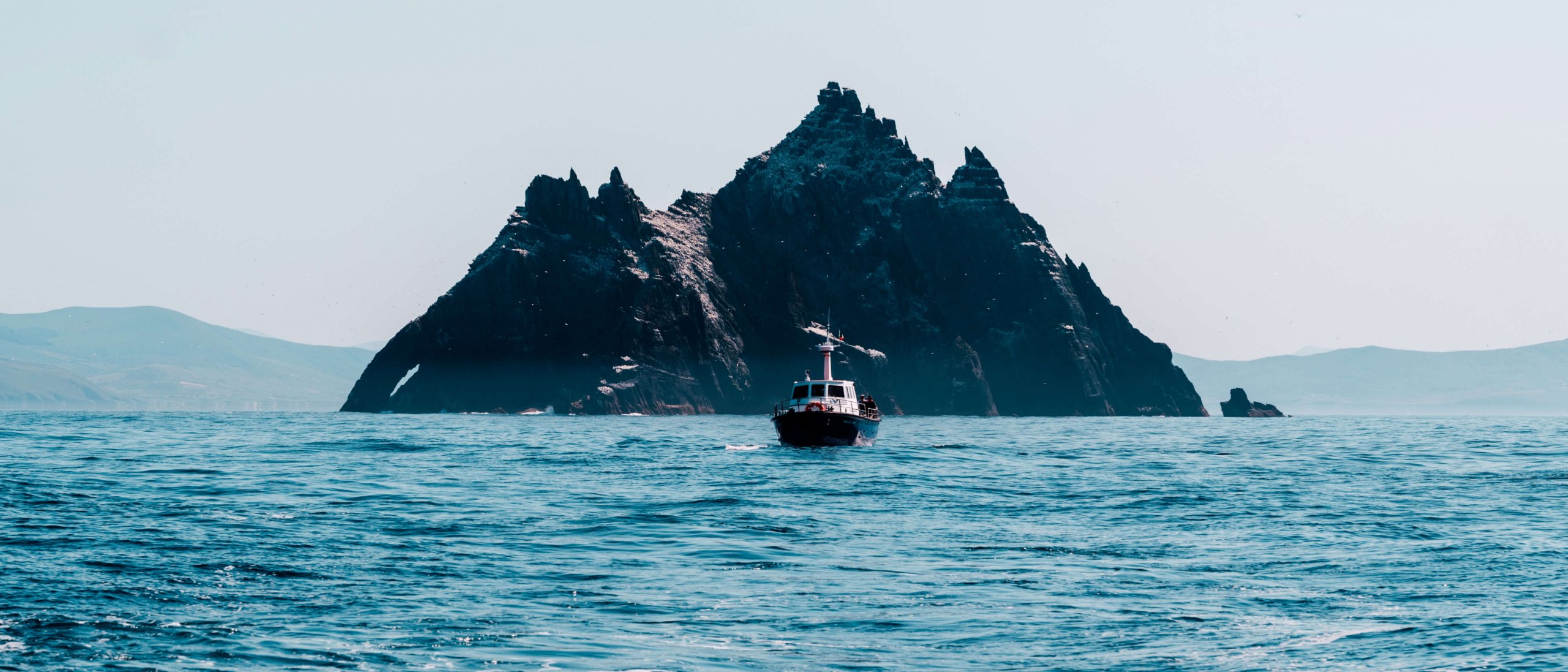 A boat in front of Little Skellig island off the coast of Ireland