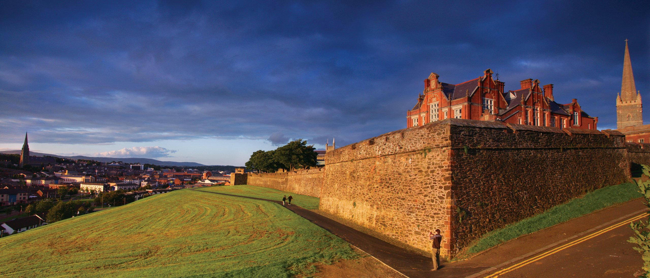 Sunlight catches the 17th century walls of Derry, Ireland's only walled city