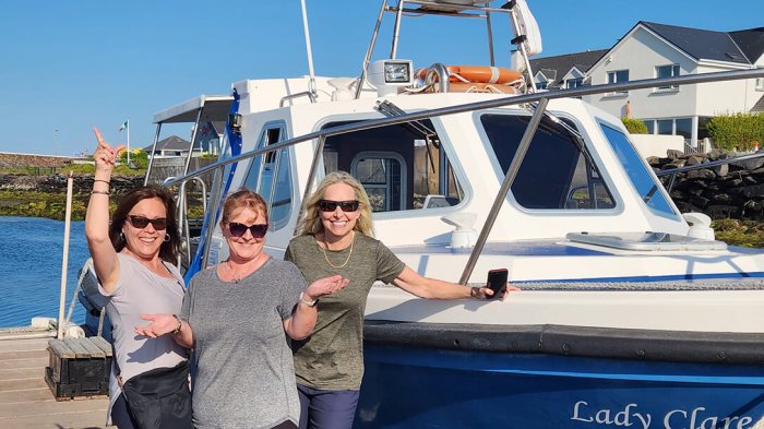 Some of our 12 Day Giant Irish Adventure Tour guests excited about their boat trip