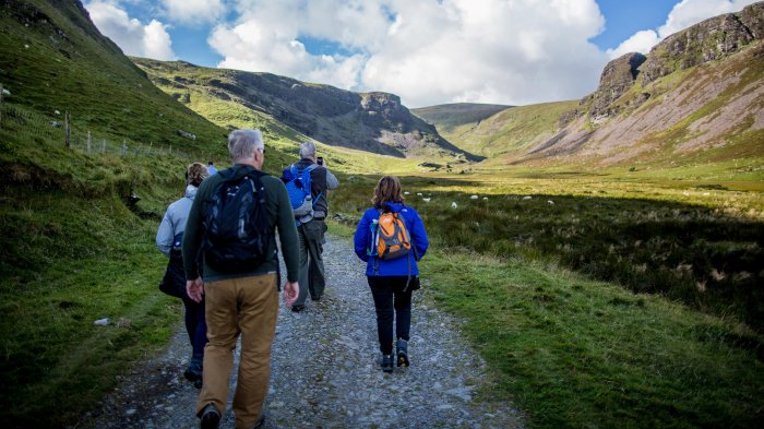 Group hiking in Annascaul valley on the Dingle peninsual
